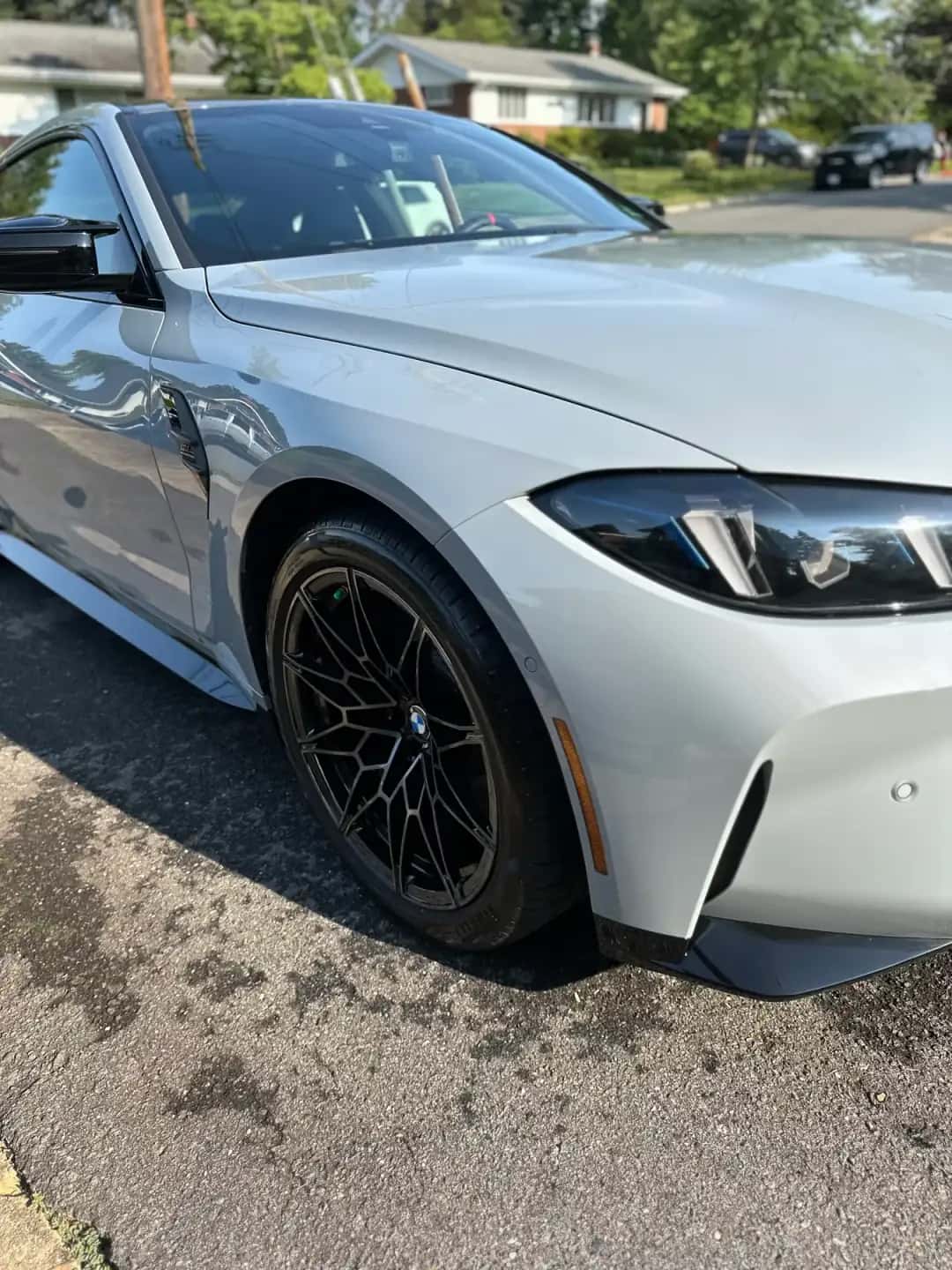 Silver BMW M with a swirl-free mirror finish