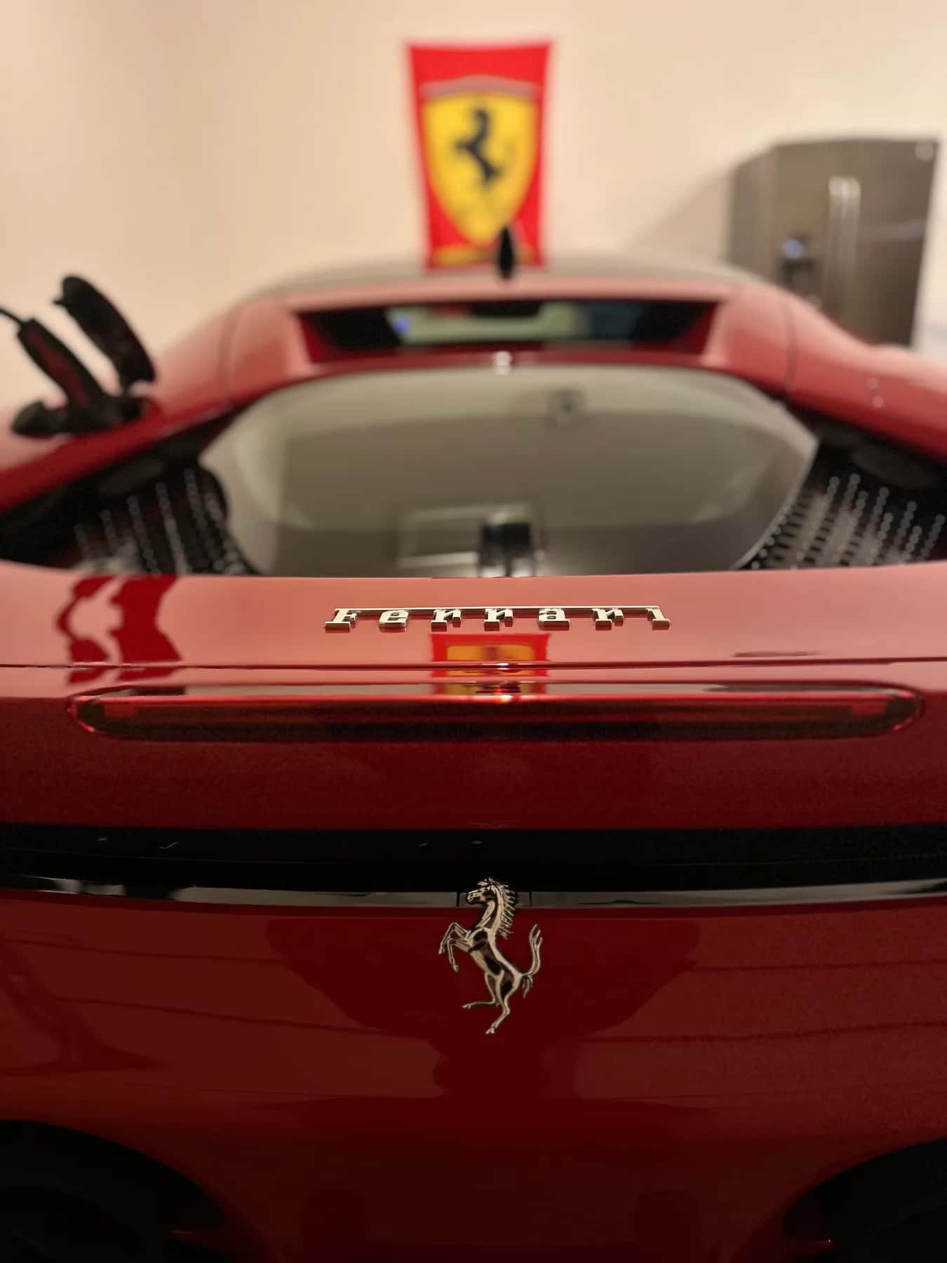Red Ferrari rear deck with a flawless finish